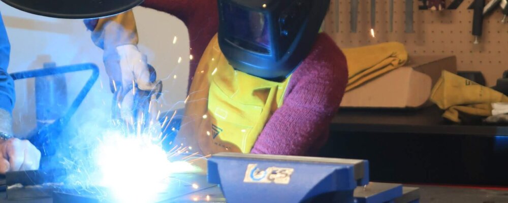 A woman is welding